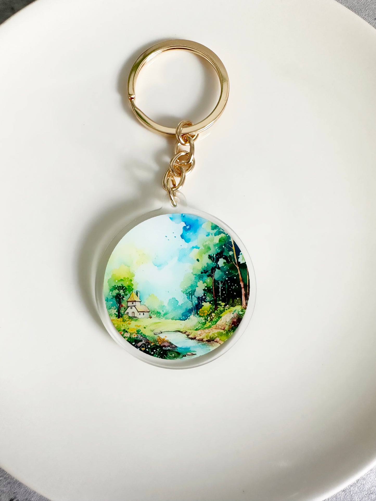 Watercolor Landscape keychain on a gold keyring