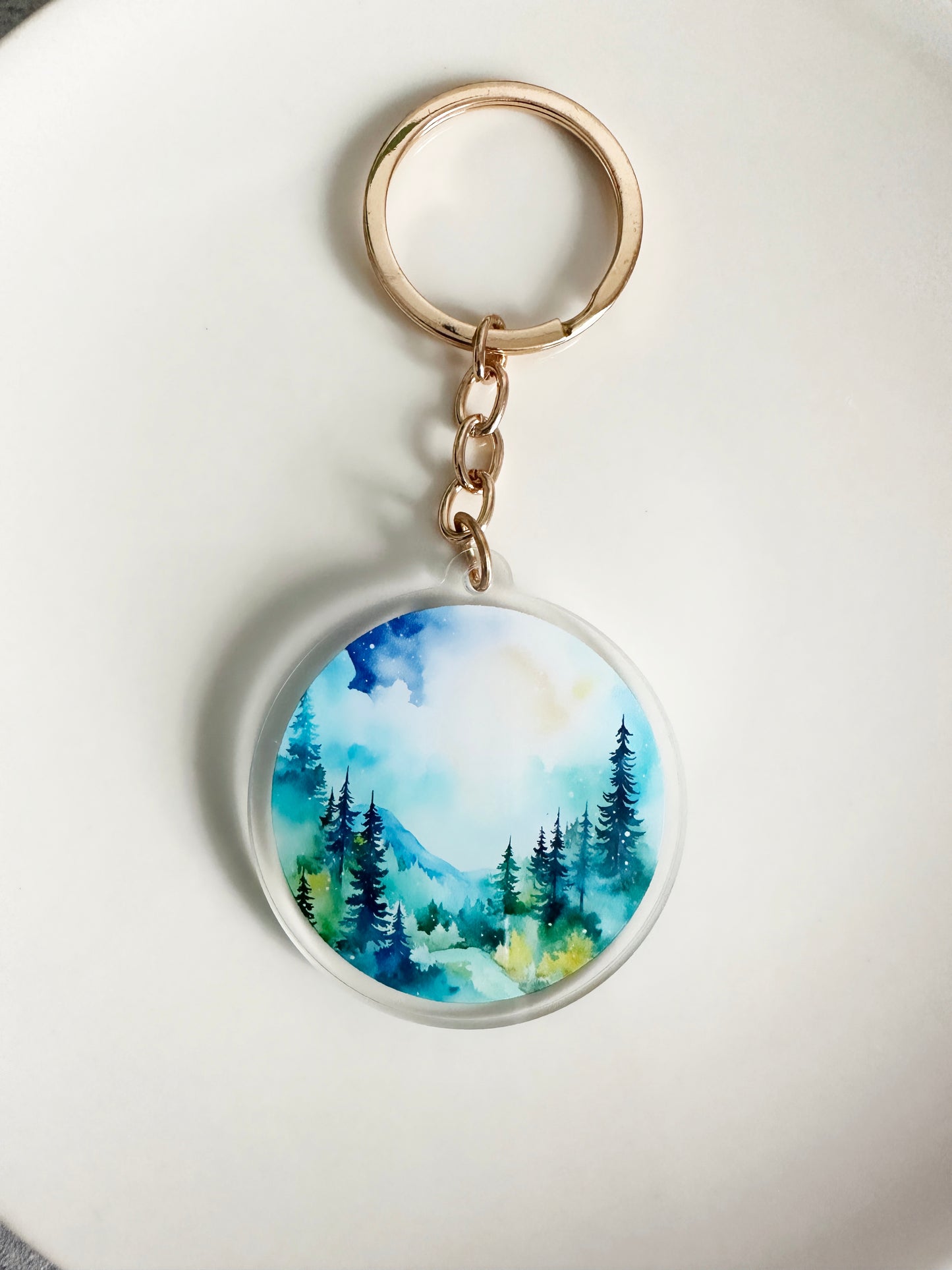 Watercolor Landscape keychain on a gold keyring