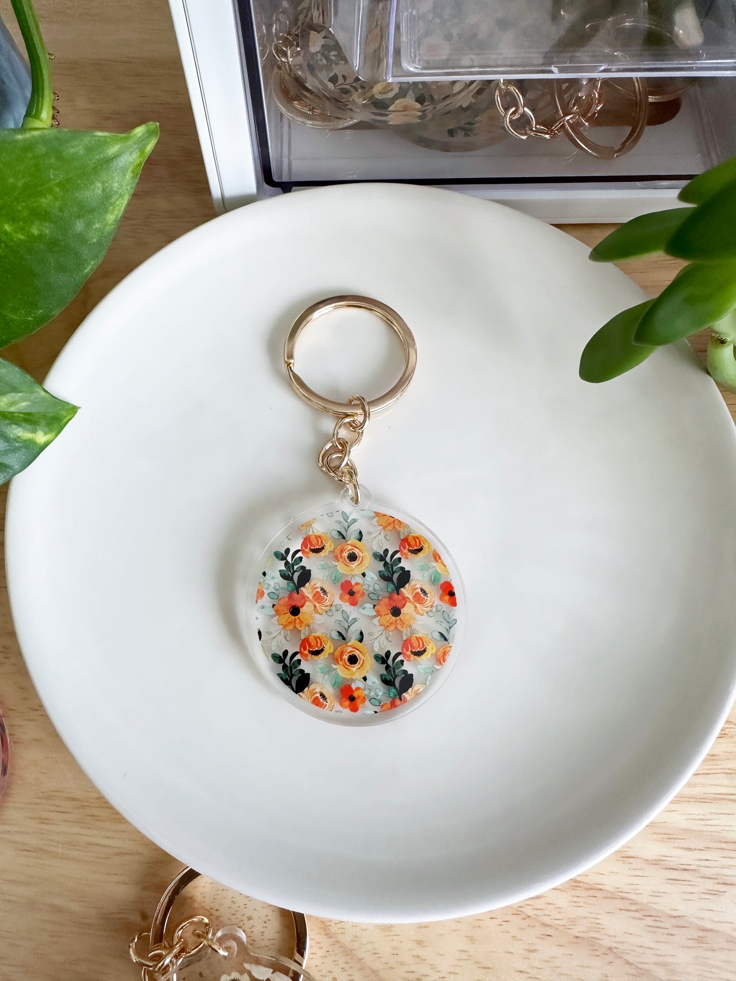 Orange and green floral keychain with gold keyring
