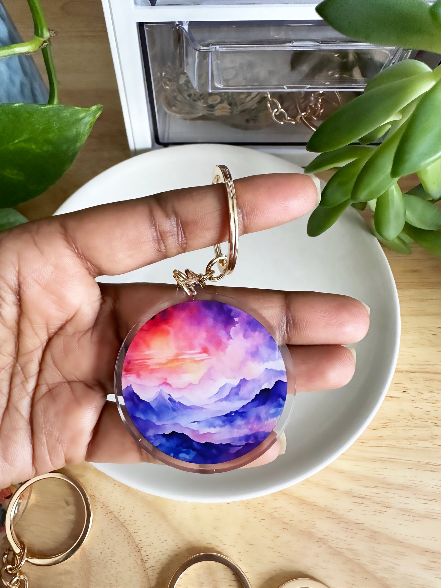 Watercolor landscape of mountain and sky keychain on a gold keyring