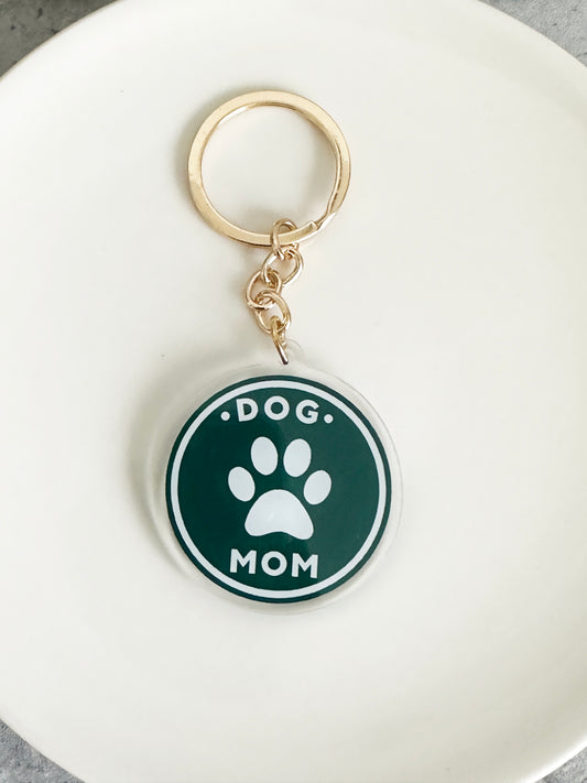 Acrylic Dog Mom Keychain with pawprint on a gold keyring 
