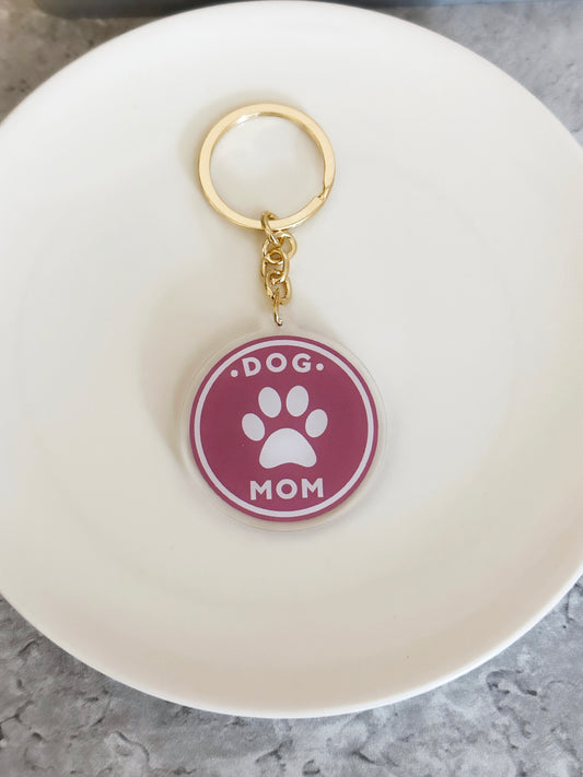 Acrylic Dog Mom Keychain with pawprint on a gold keyring 